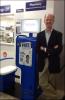 Dr. Lavery standing with the SoloHealth Kiosk at the local Sam's Club
